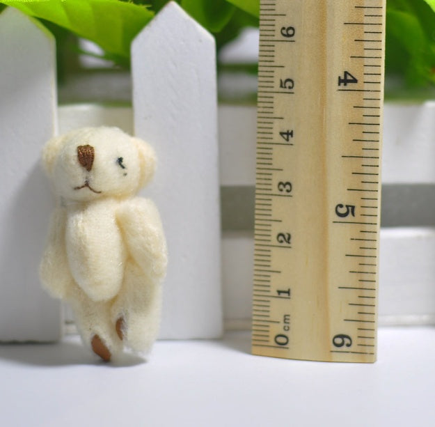 1 mini-peluche en forme d'ourson