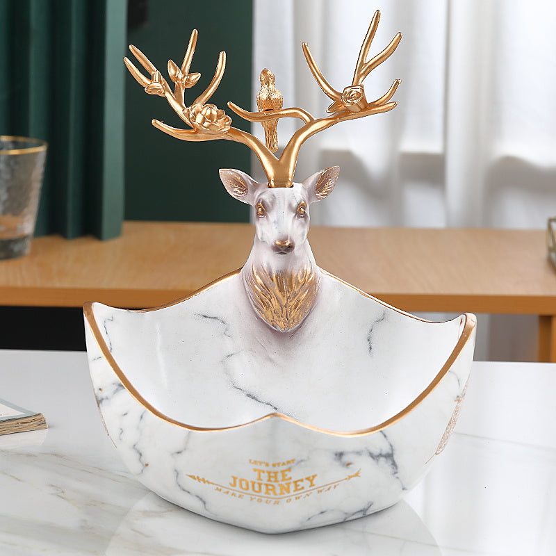The cute little deer receives the decorations