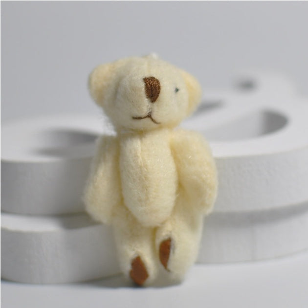 1 mini-peluche en forme d'ourson