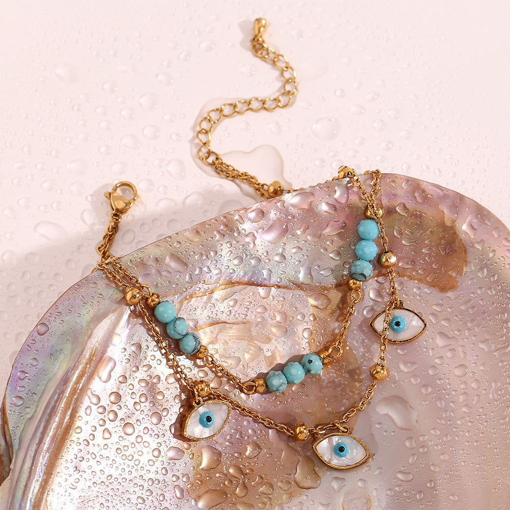 Chaîne de cheville double cercle turquoise et coquillage blanc