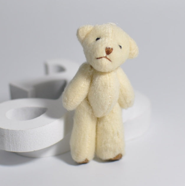 1 mini-peluche en forme d'ourson