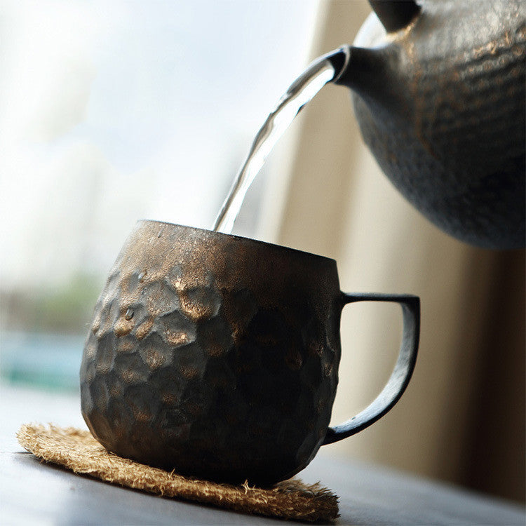 Gilt glazed ceramic tea cup