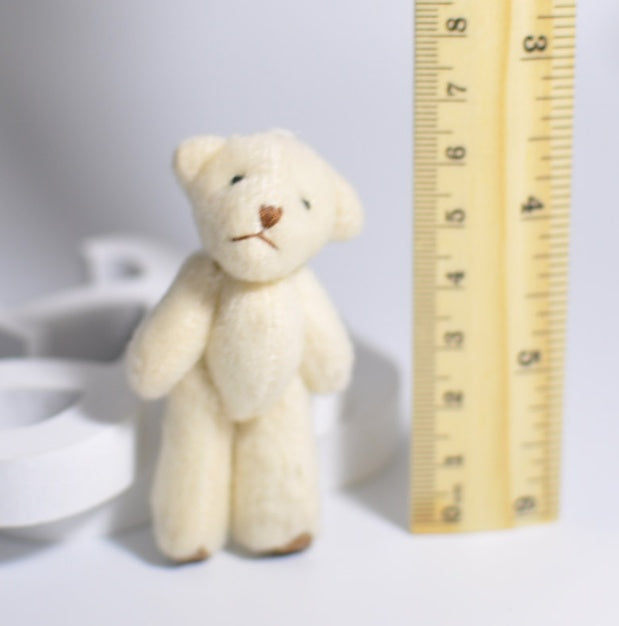 1 mini-peluche en forme d'ourson