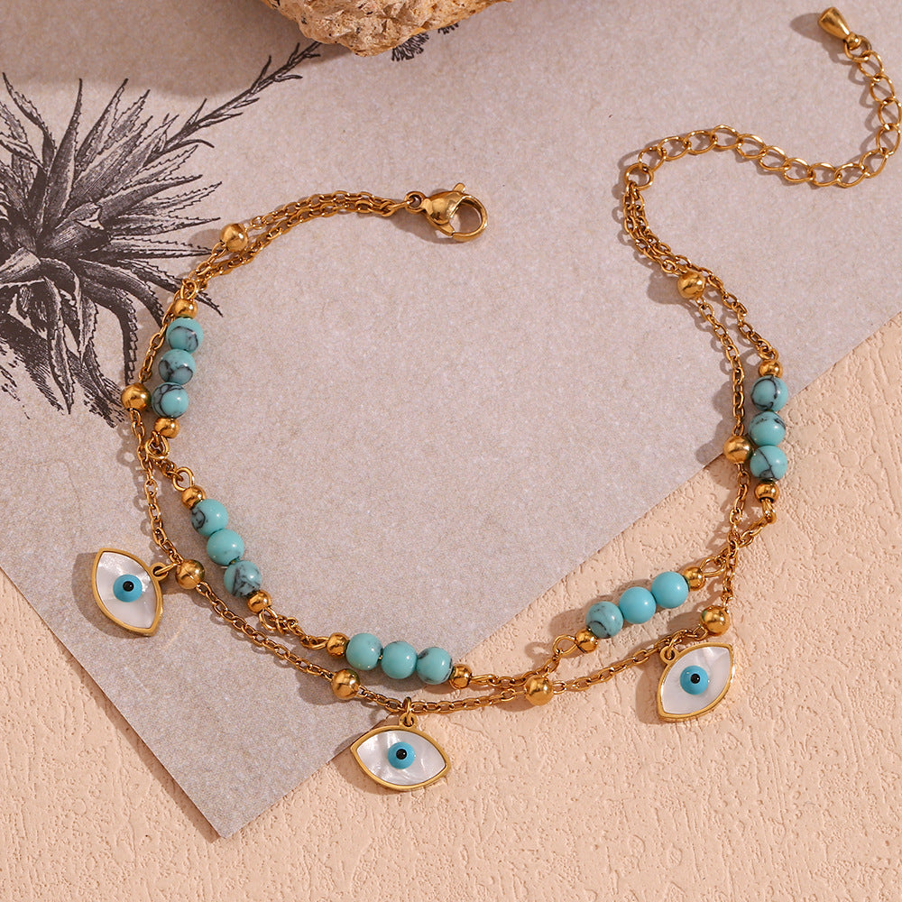 Chaîne de cheville double cercle turquoise et coquillage blanc