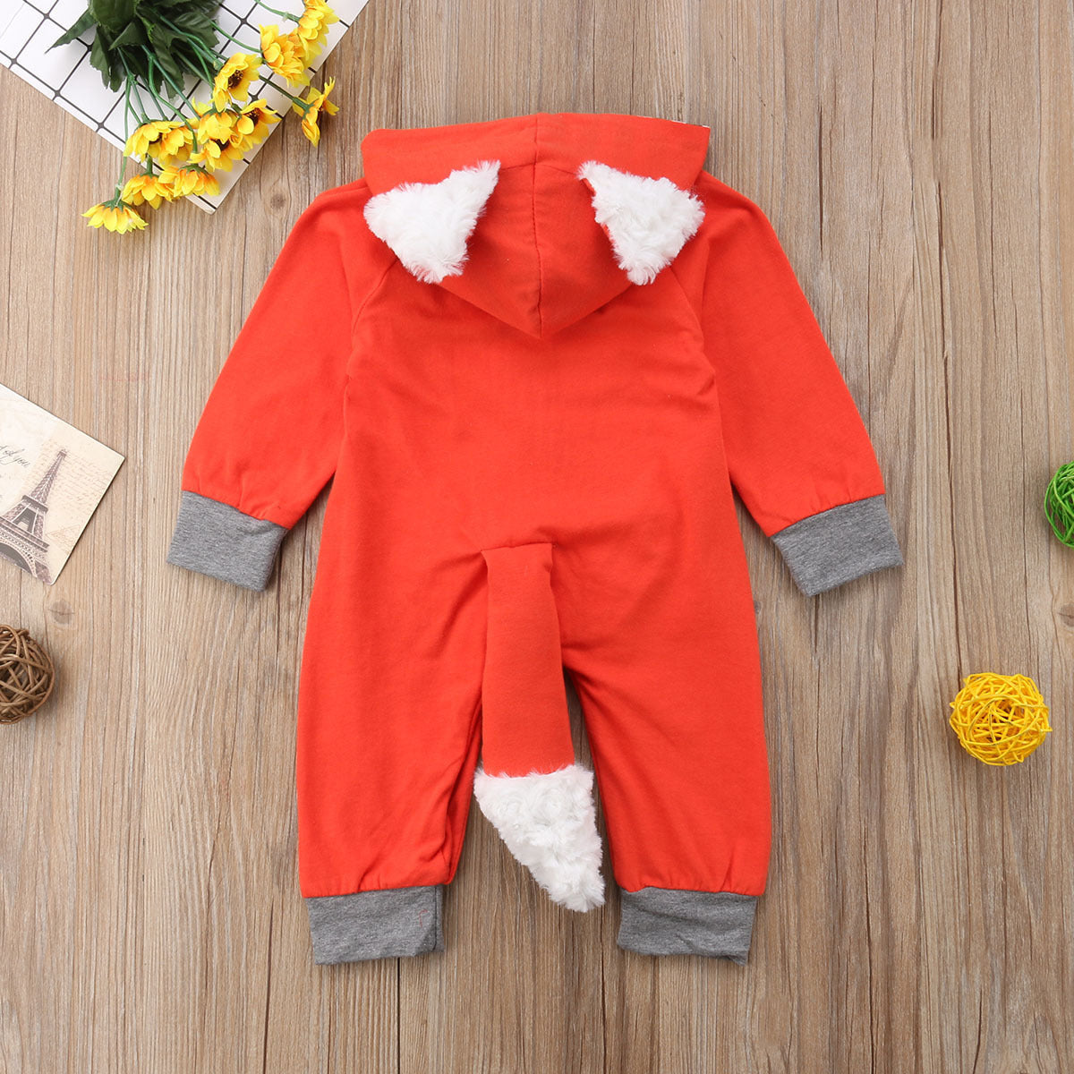 Cartoon fox in a long-sleeved onesie