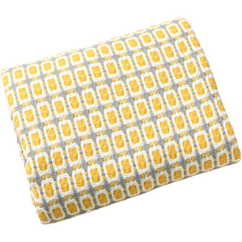 Couverture en laine à motif pied-de-poule et pompons
