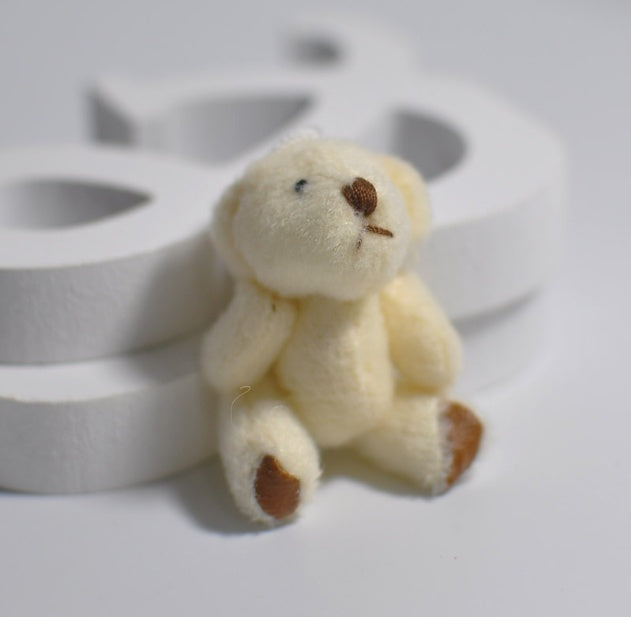 1 mini-peluche en forme d'ourson