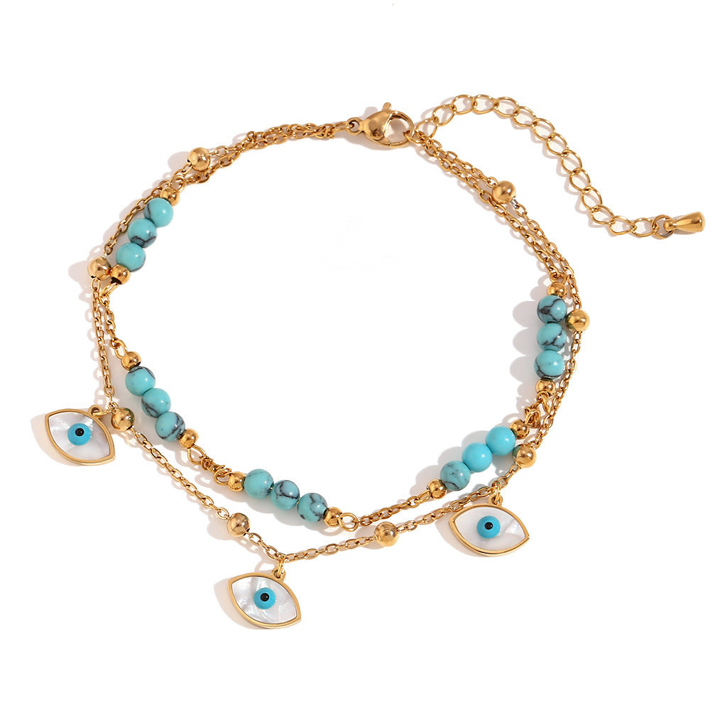 Chaîne de cheville double cercle turquoise et coquillage blanc