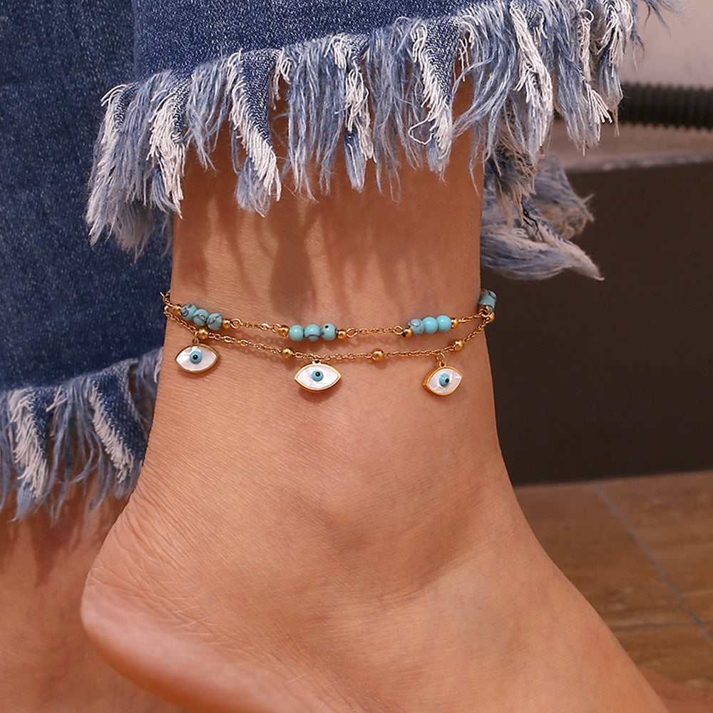 Chaîne de cheville double cercle turquoise et coquillage blanc