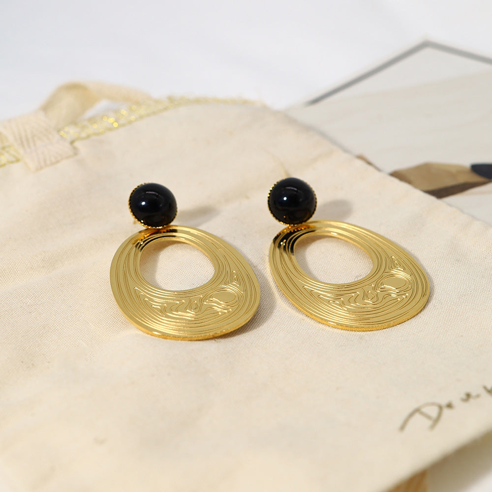 Boucles d'oreilles créoles en acier titane plaqué or 18 carats, texture concave-convexe