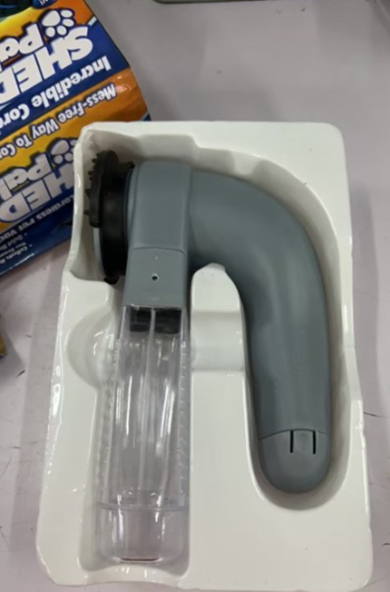 Aspirateur électrique portatif massant pour poils d'animaux