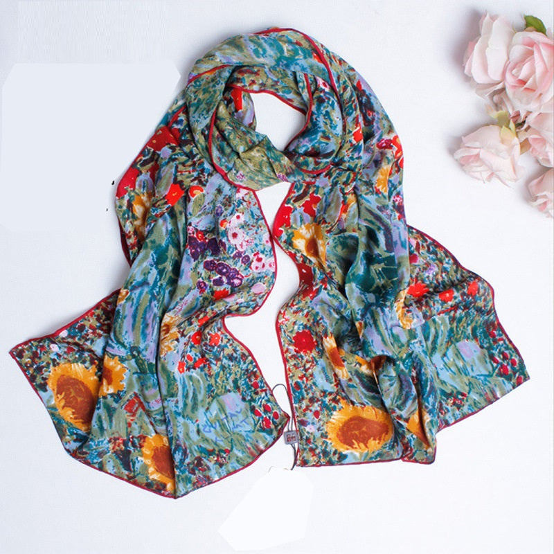 Floral and sunflower patterned scarf on a white background