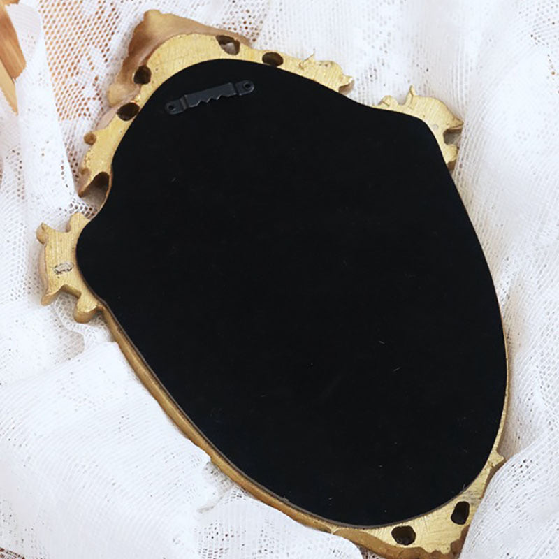 Vintage old golden embossed hollow makeup mirror