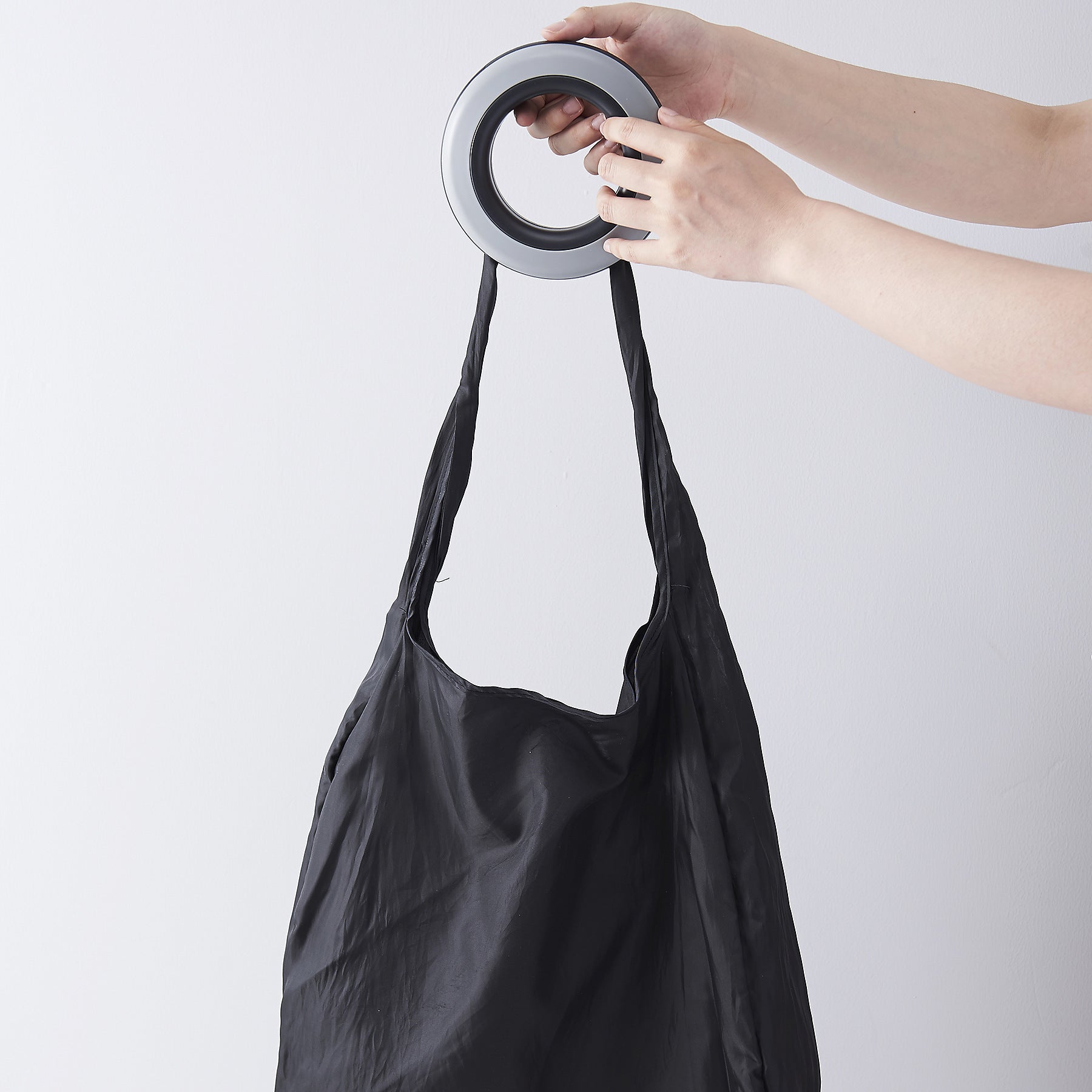 Rotating shopping bag folding storage bag