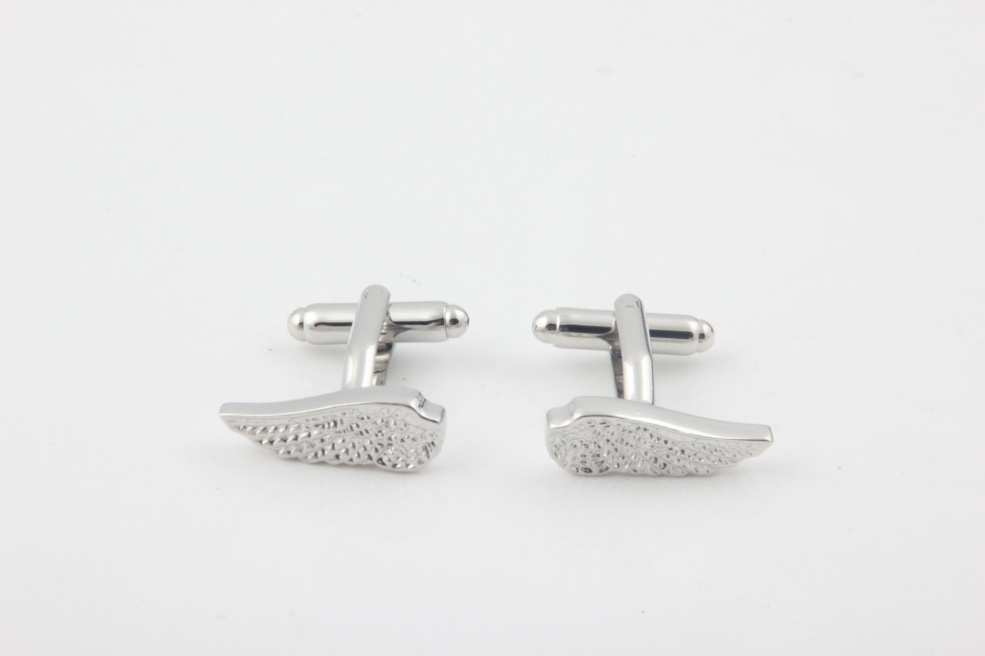 Boutons de manchette en cuivre sculpté motif Ailes d'argent