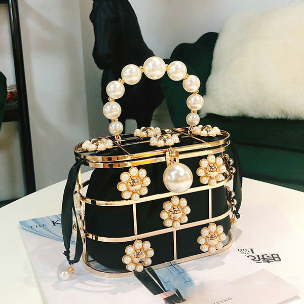 Spring new style European and American style female fashion female bag solid color bucket bag metal flower