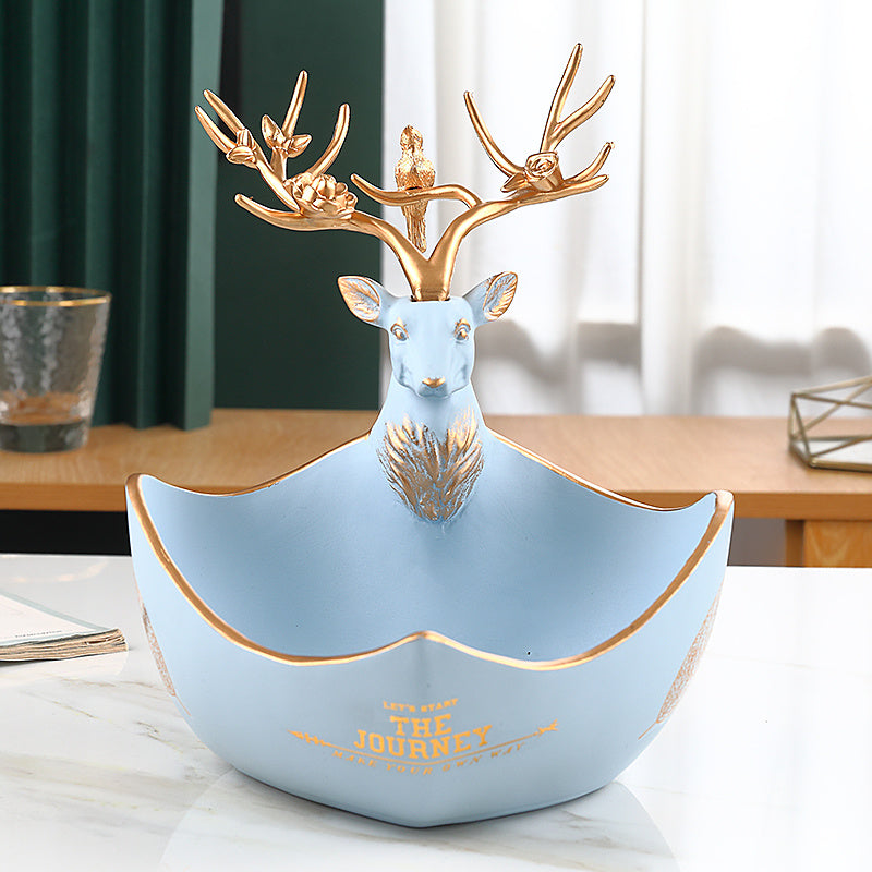 The cute little deer receives the decorations
