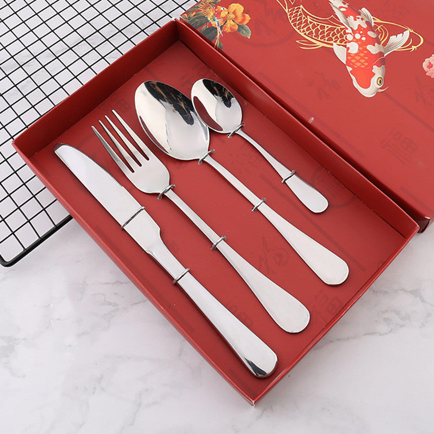 Four stainless steel cutlery