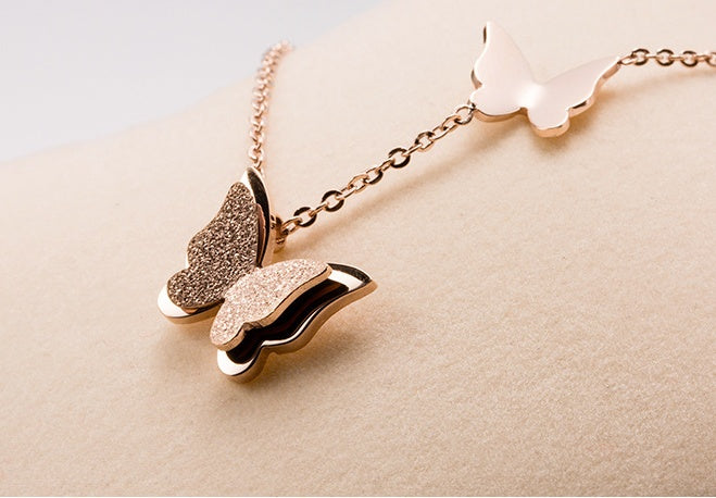 The new chain of Korean jewelry, sweet frosted double small butterfly pendants, elegant rose gold women Necklace