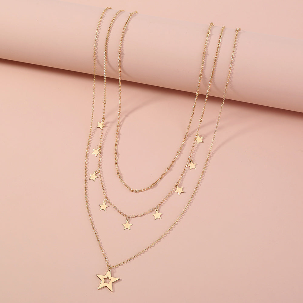 Collier multirang avec pendentif pompon étoile