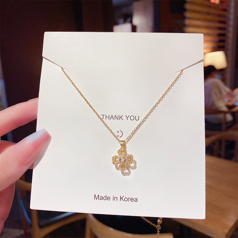 Rotating Petal Titanium Four Leaf Pendant Necklace