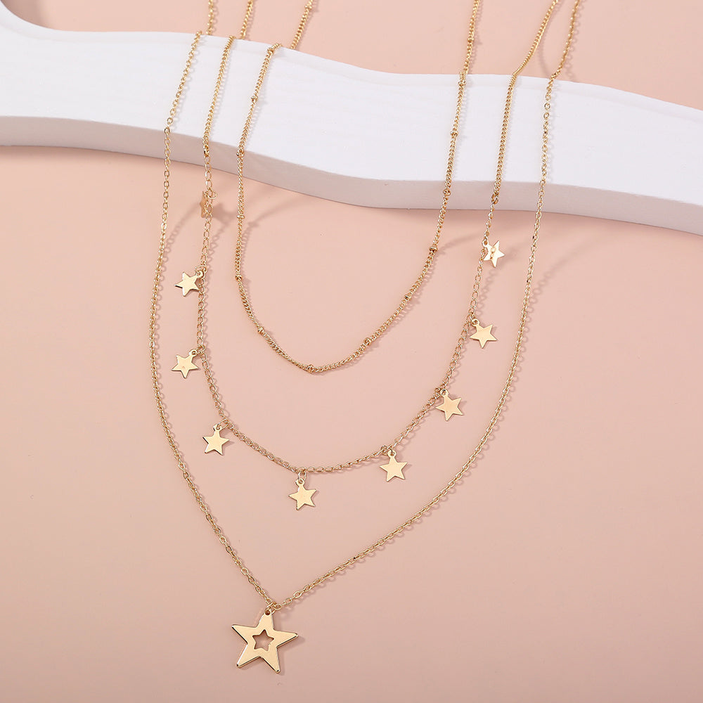 Collier multirang avec pendentif pompon étoile
