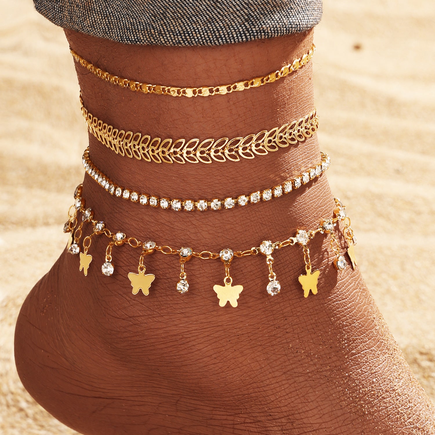 Set de cinq bracelets de cheville style plage et papillon