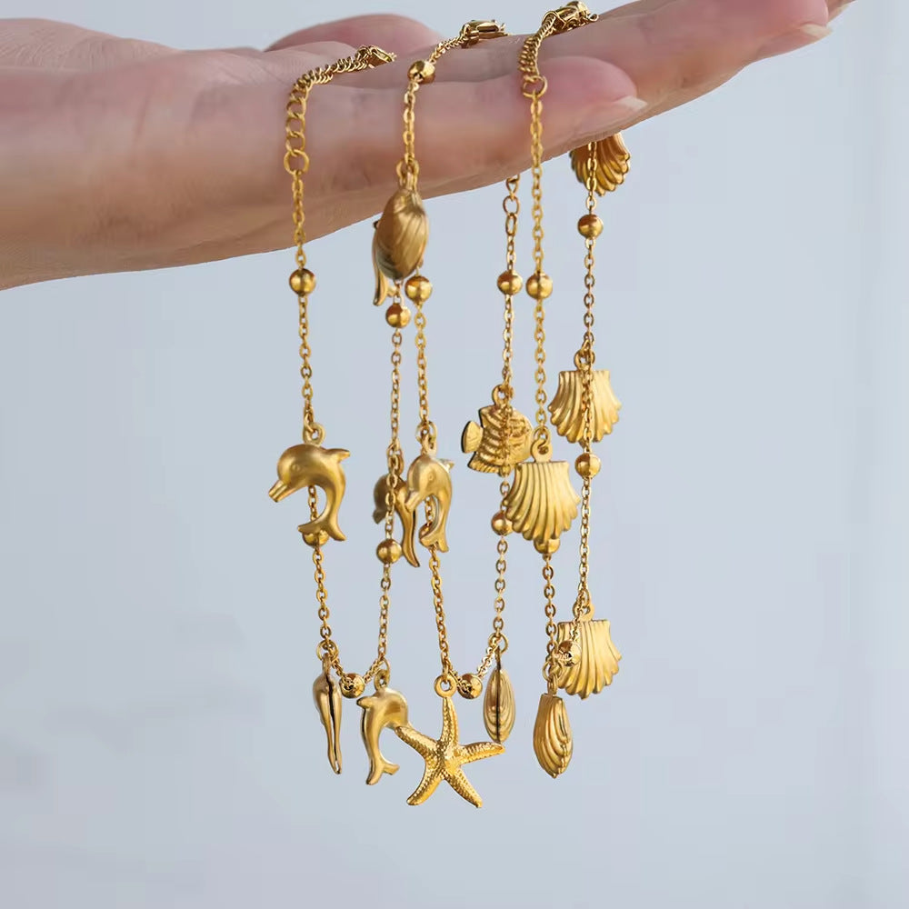 Cheville pendentif coquillage étoile de mer dauphin série océan
