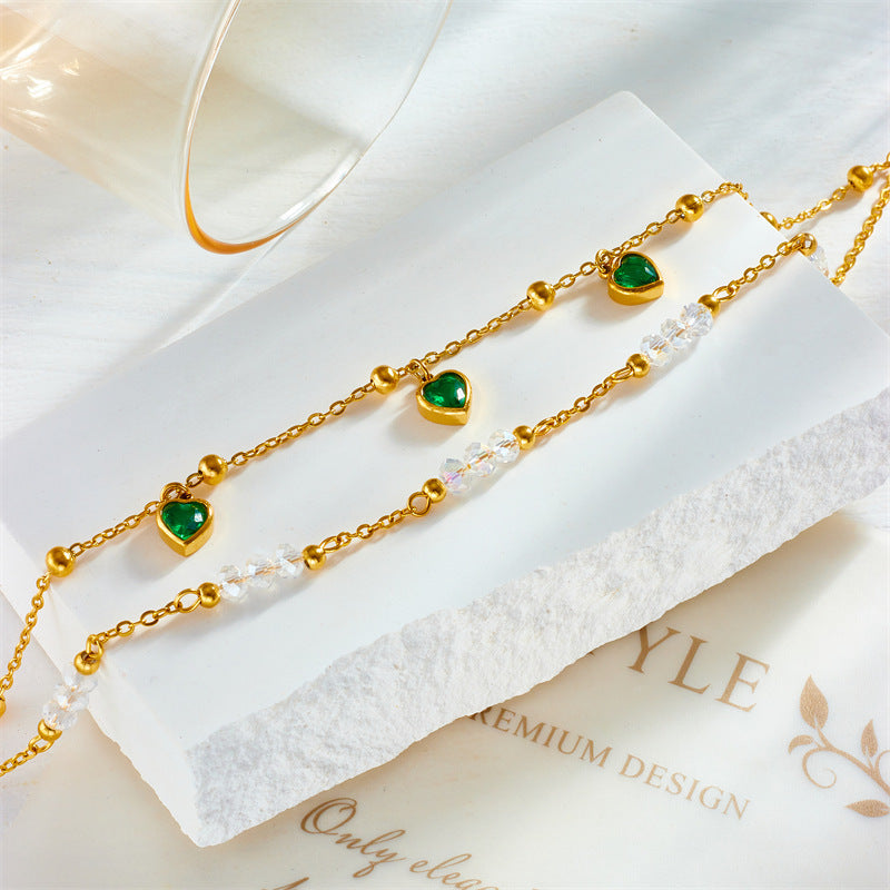 Chevillère double couche en acier titane vert et perles motif cœur
