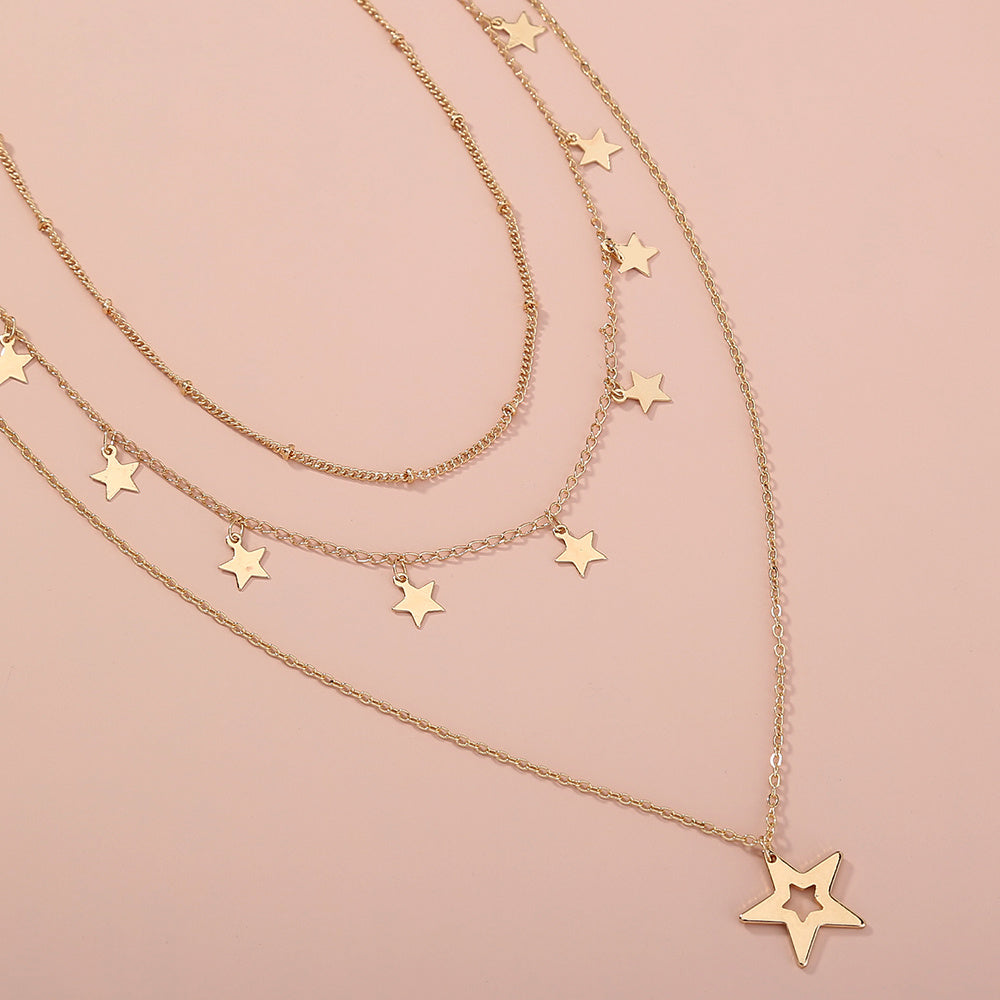 Collier multirang avec pendentif pompon étoile