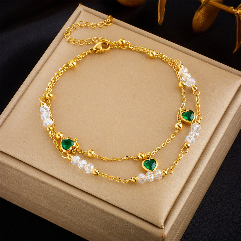 Chevillère double couche en acier titane vert et perles motif cœur