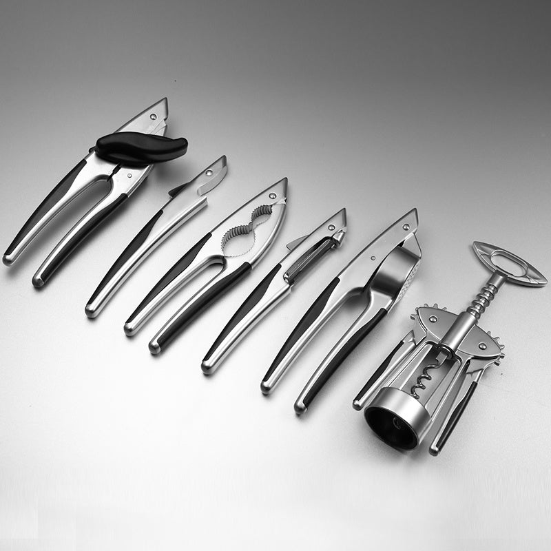 Ustensiles de cuisine Set de sept Ouvre-bouteille Presse-ail Pince à noix