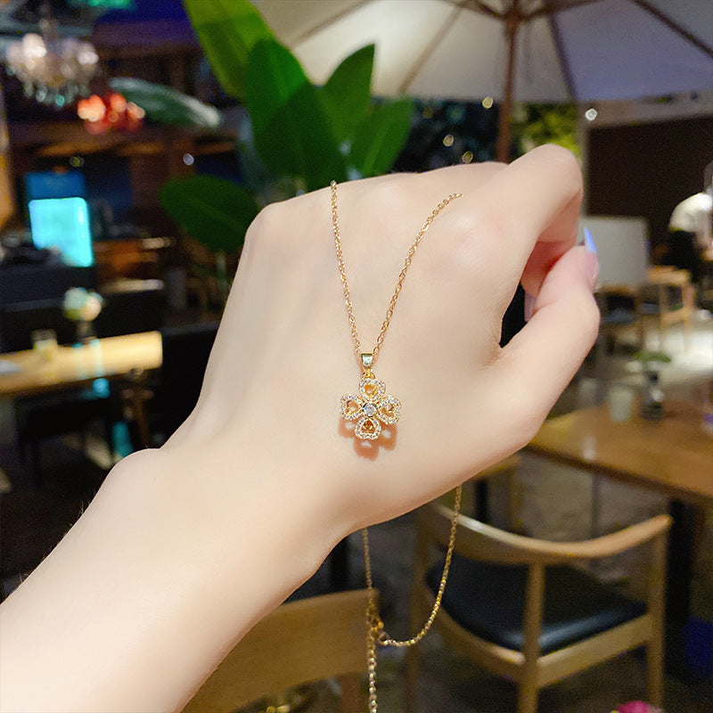 Rotating Petal Titanium Four Leaf Pendant Necklace